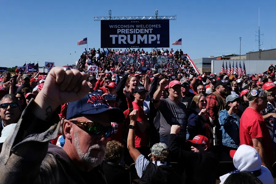 Supporters cheer as they wait for former US President and Republican presidential candidate Donald Trump at a campaign rally at the Central Wisconsin Airport in Mosinee, Wisconsin, US, on 7 September 2024.