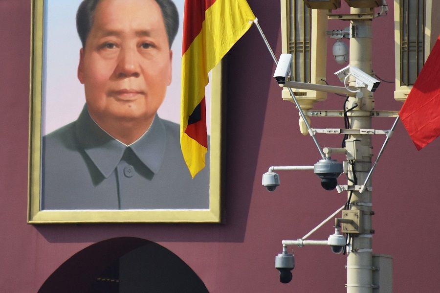 In this file photo taken on 6 September 2019, surveillance cameras are seen near the portrait of late communist leader Mao Zedong in Tiananmen Square in Beijing, China. (Greg Baker/AFP)