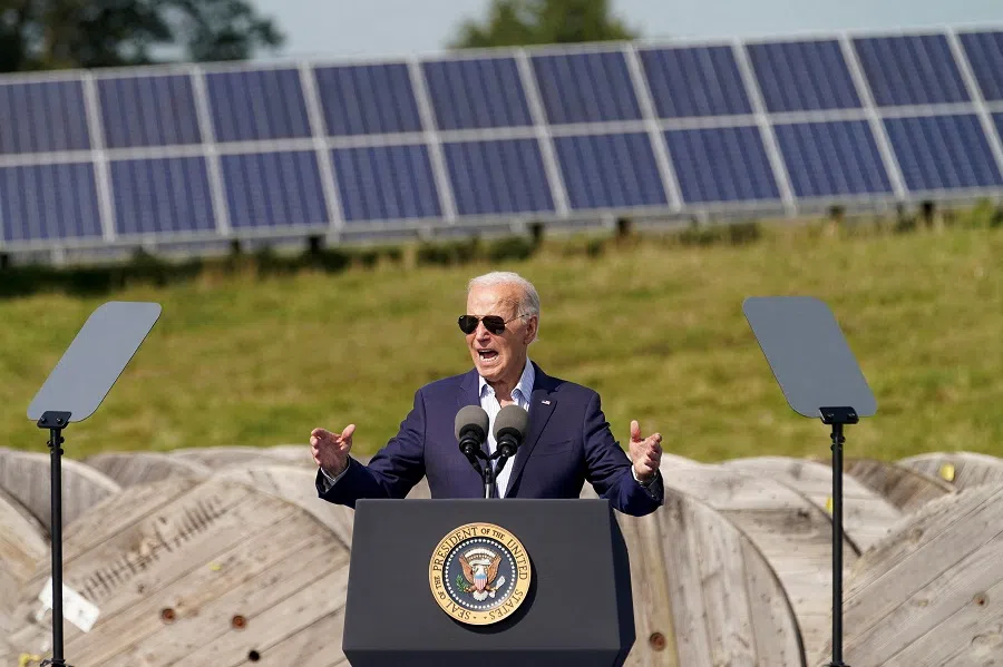 Solar panels in the background as US President Joe Biden speaks during a visit to Vernon Electric Cooperative in Westby, Wisconsin, US, on 5 September 2024. (Kevin Lamarque/Reuters)
