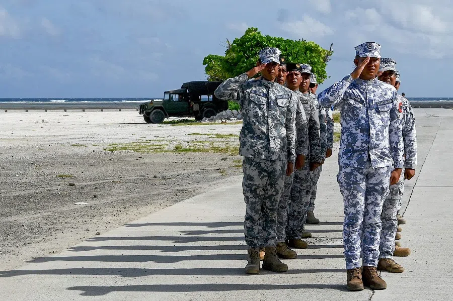 PCG personnel are seen on Thitu Island in the disputed South China Sea on 1 December 2023, for the unveiling of a PCG monitoring station. (Jam Sta Rosa/AFP)