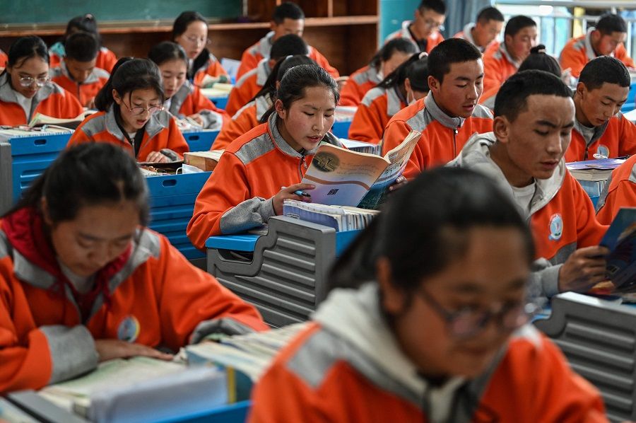 This photograph taken during a government organised media tour shows students in a classroom at the Lhasa Nagqu Second Senior High School in Lhasa, Tibet Autonomous Region, China on 1 June 2021. (Hector Retamal/AFP)