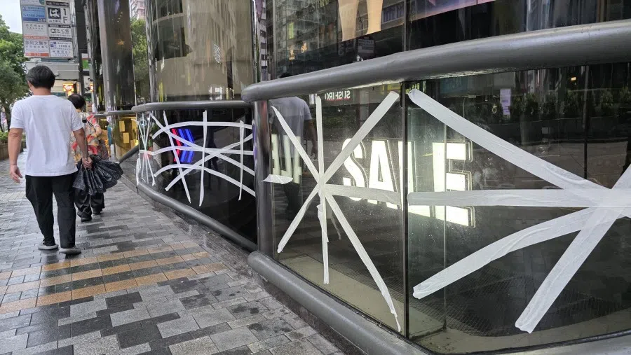 Glass panels taped up against Typhoon Wipha in Tsim Sha Tsui, Hong Kong, on 20 July 2025. (Candice Chan/SPH Media)