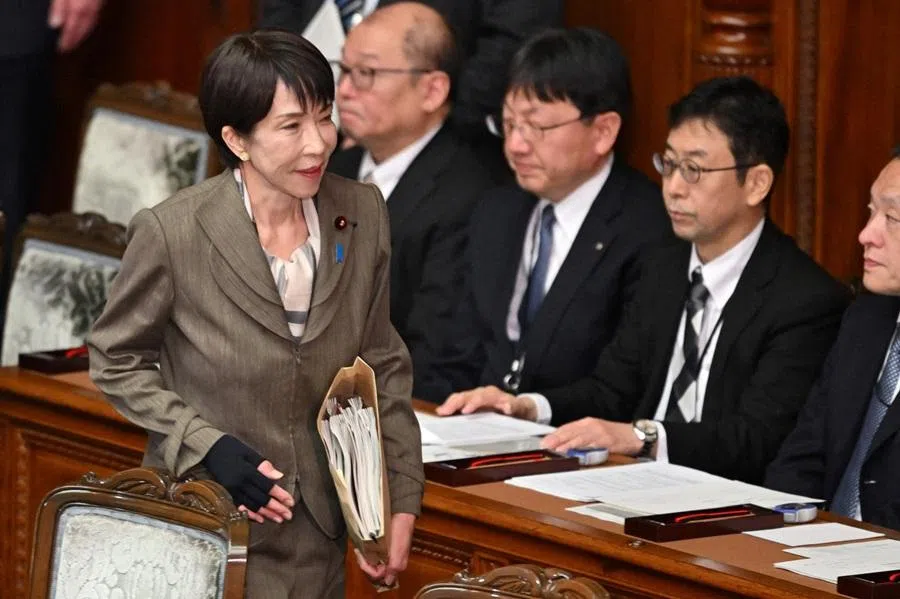 Japan's Prime Minister Sanae Takaichi (left) attends a plenary session of the House of Representatives in Tokyo on 24 February 2026.