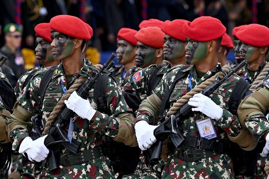 Soldiers parade during a ceremony marking the 25th anniversary of the formation of the Royal Cambodian Army in Phnom Penh, Cambodia on 24 January 2024. (Tang Chhin Sothy/AFP)
