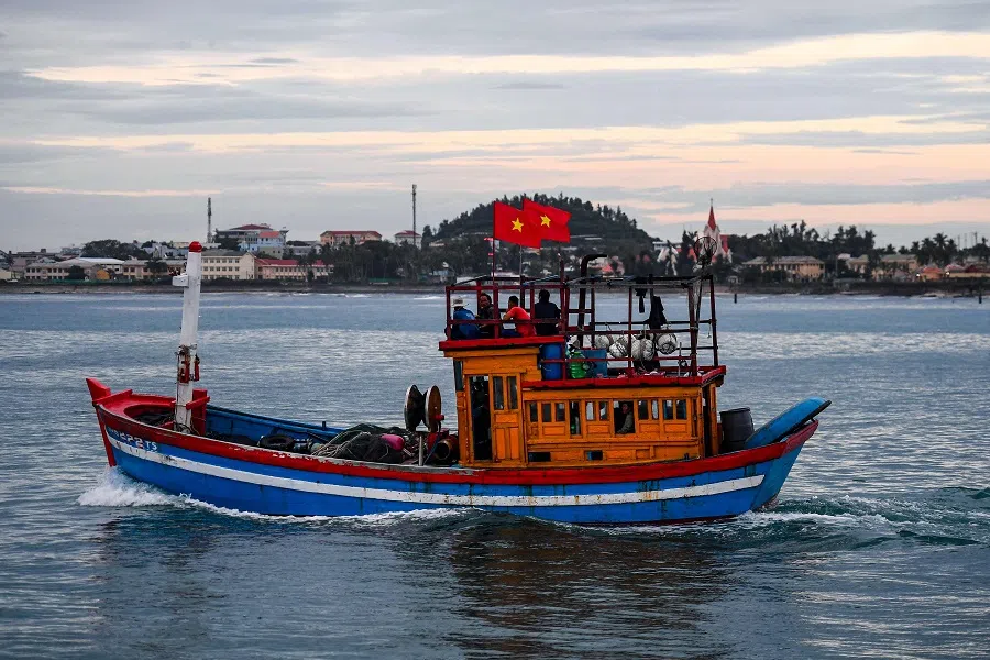 This photo taken on 19 August 2022, shows a fishing boat sailing near Vietnam's offshore Ly Son island, the country's closest island to the disputed Paracel archipelago in the South China Sea region. (Nhac Nguyen/AFP)