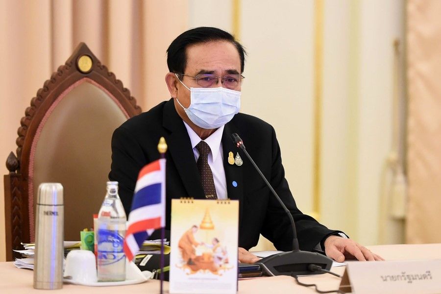 This handout from the Royal Thai Government taken and released on April 3, 2020 shows Thailand's Prime Minister Prayut Chan-O-Cha during a special cabinet meeting to discuss measures to stop the spread of the coronavirus at the Government House in Bangkok. (Handout/ROYAL THAI GOVERNMENT/AFP)