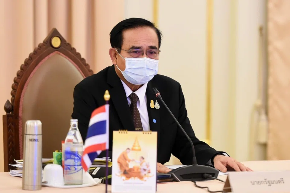 This handout from the Royal Thai Government taken and released on April 3, 2020 shows Thailand's Prime Minister Prayut Chan-O-Cha during a special cabinet meeting to discuss measures to stop the spread of the coronavirus at the Government House in Bangkok. (Handout/ROYAL THAI GOVERNMENT/AFP)