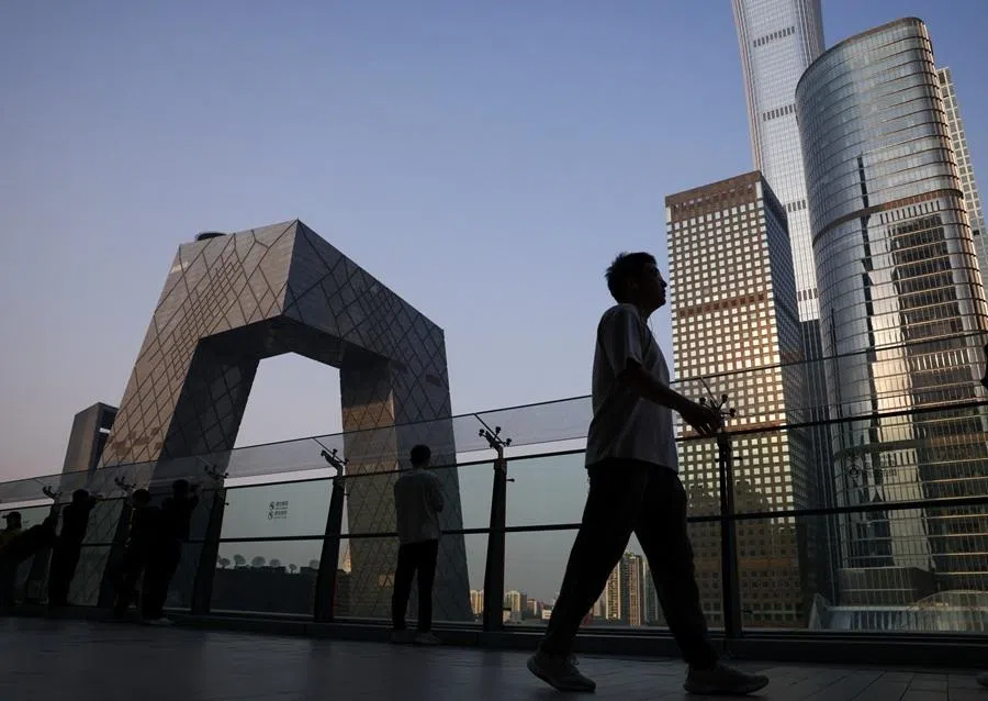 People visit the terrace of a shopping mall overlooking the central business district in Beijing, China, 12 May 2026.