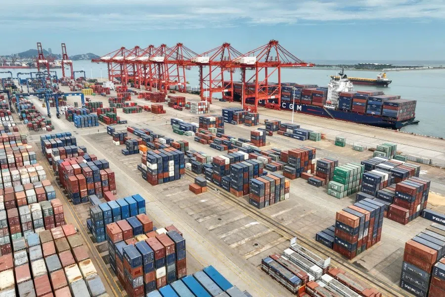 This aerial photo taken on 16 July 2023 shows cranes and shipping containers at Lianyungang port in China's eastern Jiangsu province. (AFP)