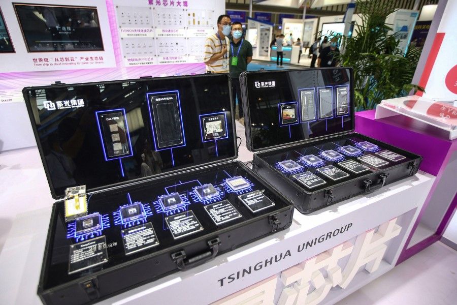 Chips by Tsinghua Unigroup are seen at the 2020 World Semiconductor Conference in Nanjing in China's eastern Jiangsu province on 26 August 2020. (STR/AFP)