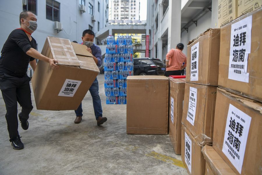 Workers of the Hainan Red Cross Society transport donated medical supplies. (CNS)