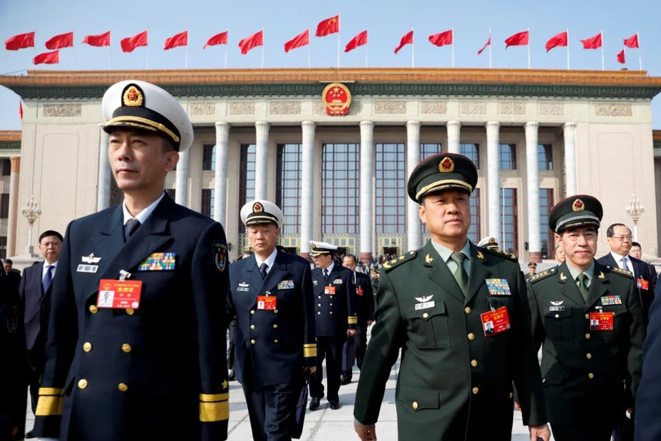 Military delegates leave the Great Hall of the People after a meeting ahead of National People's Congress (NPC), China's annual session of parliament, in Beijing, 4 March 2019. (Aly Song/REUTERS)