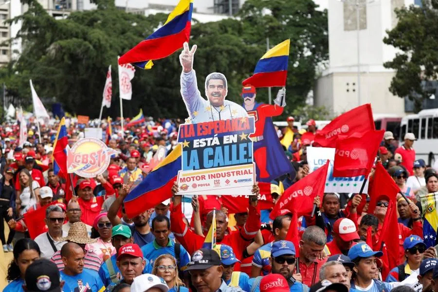 A demonstrator holds a sign reading “Hope is in the street” during a march to demand the release of captured President Nicolás Maduro and his wife Cilia Flores, following their capture by US forces during US strikes on Venezuela, in Caracas, Venezuela, on 14 January 2026.