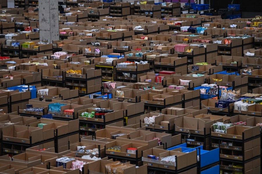 This picture taken on 6 November 2020 shows an area of products which are moved by robots in the warehouse of Cainiao Smart Logistics Network, the logistics affiliate of e-commerce giant Alibaba, in Wuxi, China's eastern Jiangsu province, ahead of Singles' Day. (Hector Retamal/AFP)