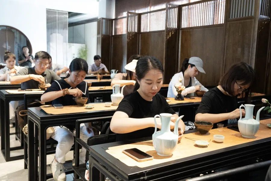 People at a tea-brewing activity in Yucun. (CNS)