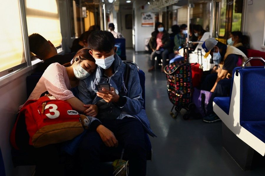 People wear protective masks to prevent the spread of the coronavirus disease (COVID-19) while taking the train in Taipei, Taiwan, 3 November 2020. (Ann Wang/REUTERS)