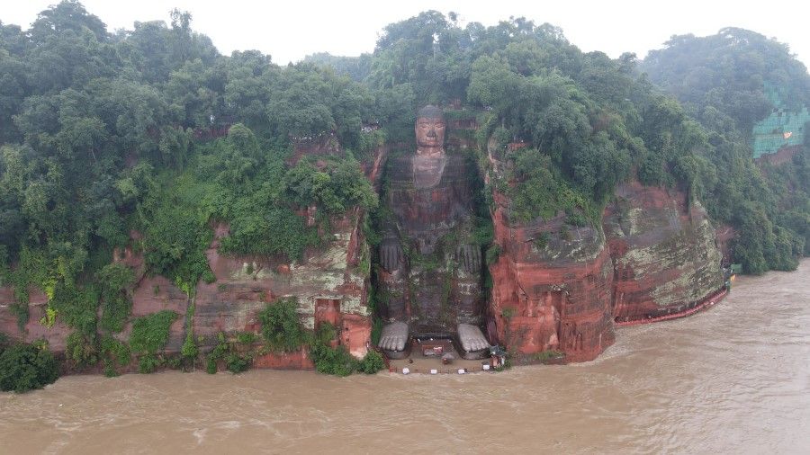 The floodwaters meeting the toes of the Leshan Giant Buddha. (CNS)