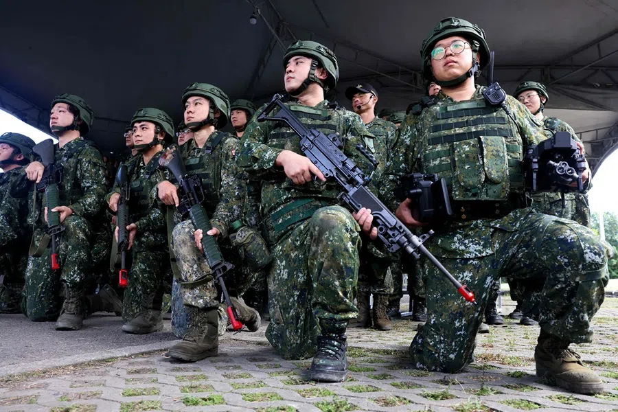 Taiwan reservists pose for photos during a training session at Loung Te Industrial Parks Service Center, in Yilan county on 2 December 2025. (I-Hwa Cheng/AFP)