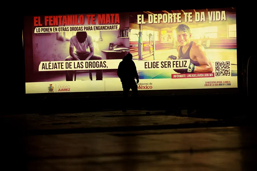 A man walks in front of an advertisement for the campaign “Stay away from drugs. Fentanyl kills you” by the Mexican government, in Ciudad Juarez, Mexico, on 13 February 2025. (Jose Luis Gonzalez/Reuters)