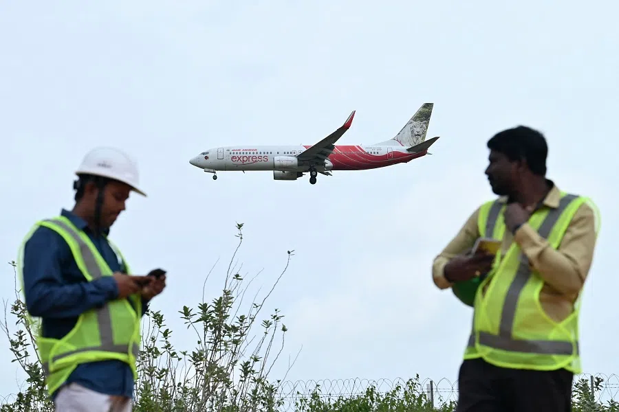 An Air India Express aircraft prepares to land at Kempegowda International Airport in Bengaluru on 4 September 2024. (Idrees Mohammed/AFP)