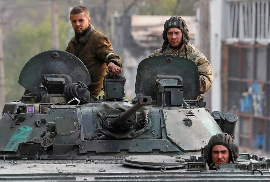 Service members of pro-Russian troops ride an infantry combat vehicle during fighting in the Ukraine-Russia conflict near the Azovstal steel plant in the southern port city of Mariupol, Ukraine, 5 May 2022. (Alexander Ermochenko/Reuters)
