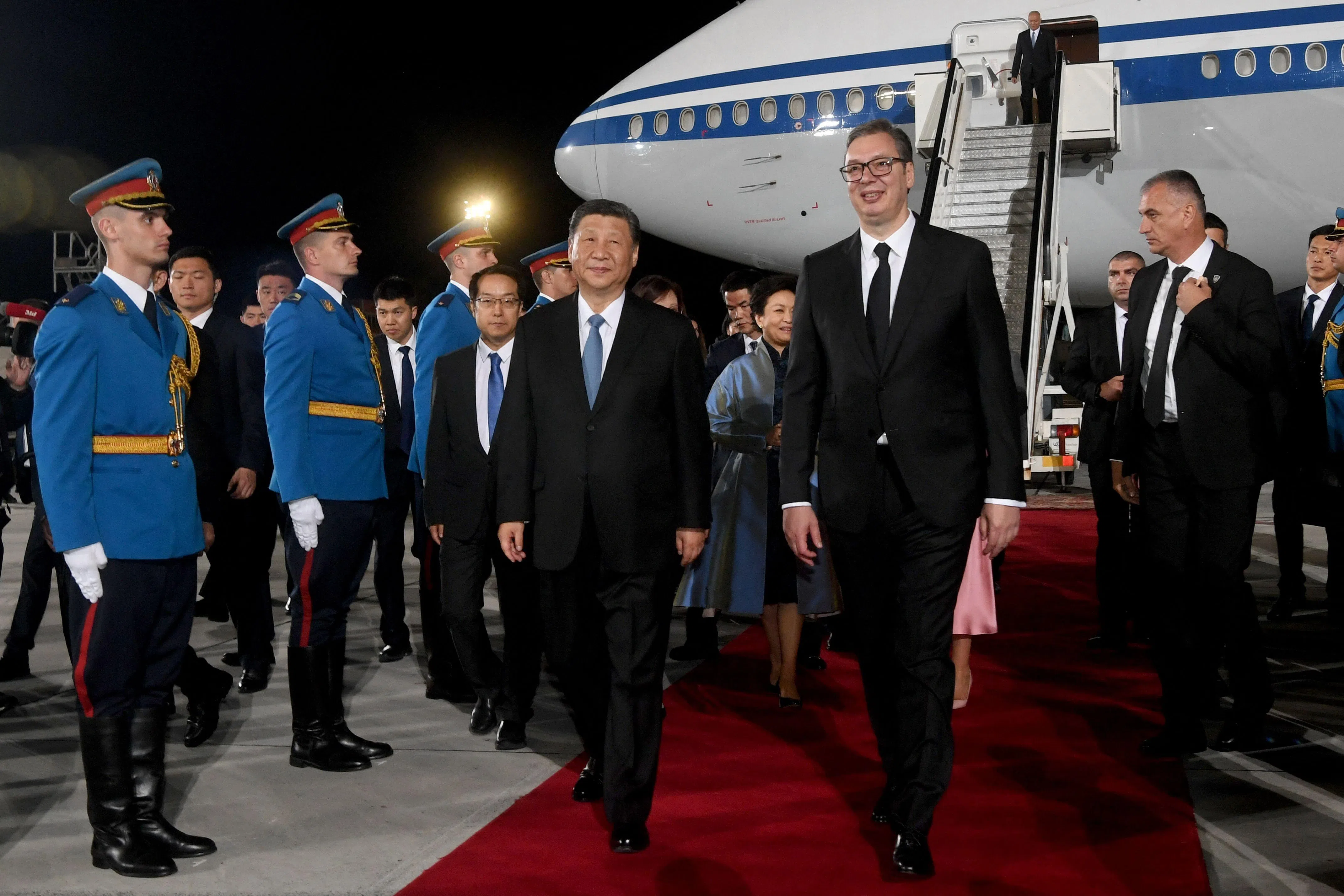 This handout photograph taken and released by Serbia’s Presidential press service on 7 May 2024, shows Serbian President Aleksandar Vucic (centre right) and Chinese President Xi Jinping (centre left) during a welcoming ceremony at Belgrade Airport, at the second stop of Xi’s European tour after a state visit to France. (Dimitrije Goll/Serbia’s Presidential press service/AFP)