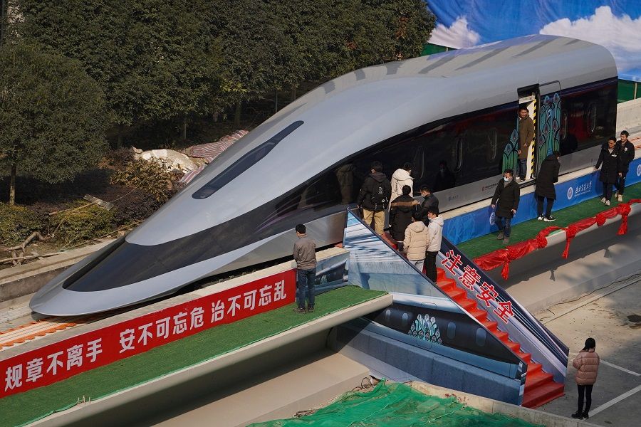 People visit a prototype magnetic levitation train developed with high-temperature superconducting (HTS) maglev technology at the launch ceremony in Chengdu, Sichuan province, China, on 13 January 2021. (STR/AFP)