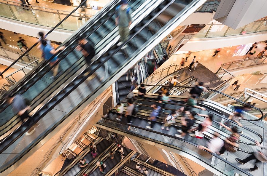 A shot of people on escalators at an urban shopping mall in Hong Kong. (iStock)