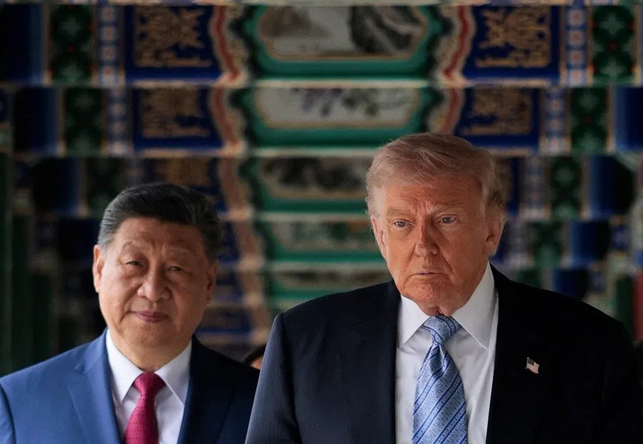 US President Donald Trump walks through Zhongnanhai Garden with Chinese President Xi Jinping in Beijing, China, on 15 May 2026.