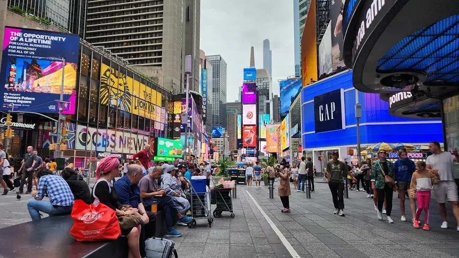 Pedestrians walk in Times Square, New York, US, on 24 August 2023. (SPH Media)