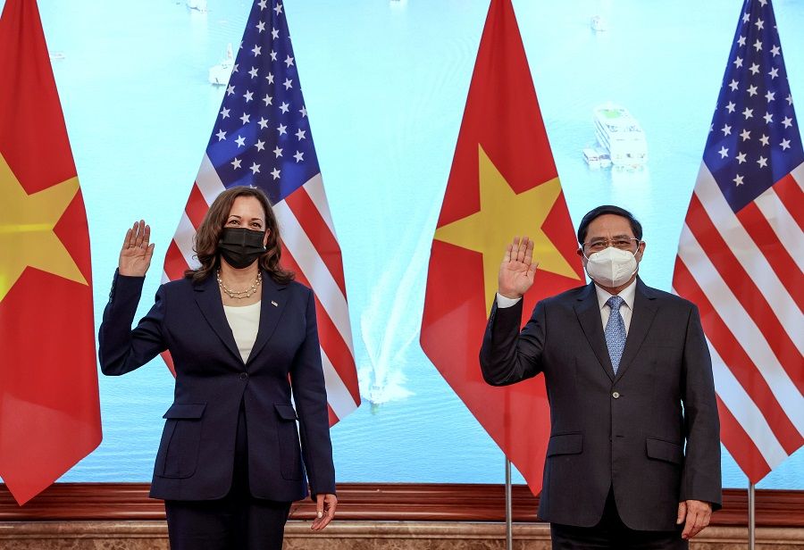 US Vice-President Kamala Harris meets Vietnam's Prime Minister Pham Minh Chinh during a meeting at the Office of Government, in Hanoi, Vietnam, 25 August 2021. (Evelyn Hockstein/Pool/Reuters)