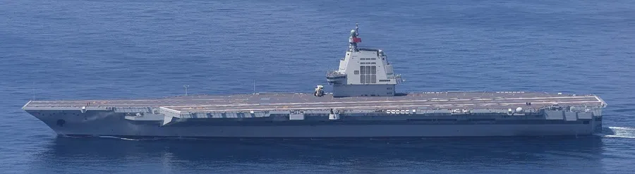 This handout photo taken by Japan's Ministry of Defense on 11 September 2025 and received via Jiji Press on 12 September 2025 shows China's third and newest aircraft carrier, Fujian, sailing in the East China Sea. (Japan’s Ministry of Defense via Jiji Press/AFP)