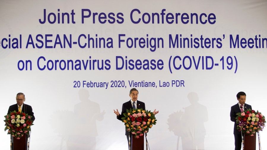 China's Foreign Minister Wang Yi (C), Secretary of Foreign Affairs of the Philippines Teodoro Lopez (L) and Laos Foreign Minister Saleumxay Kommasith at a press conference after a meeting of the Association of South East Asian Nations (ASEAN) and China about the coronavirus outbreak, in Vientiane, Laos, February 20, 2020. (Phoonsab Thevongsa/REUTERS)