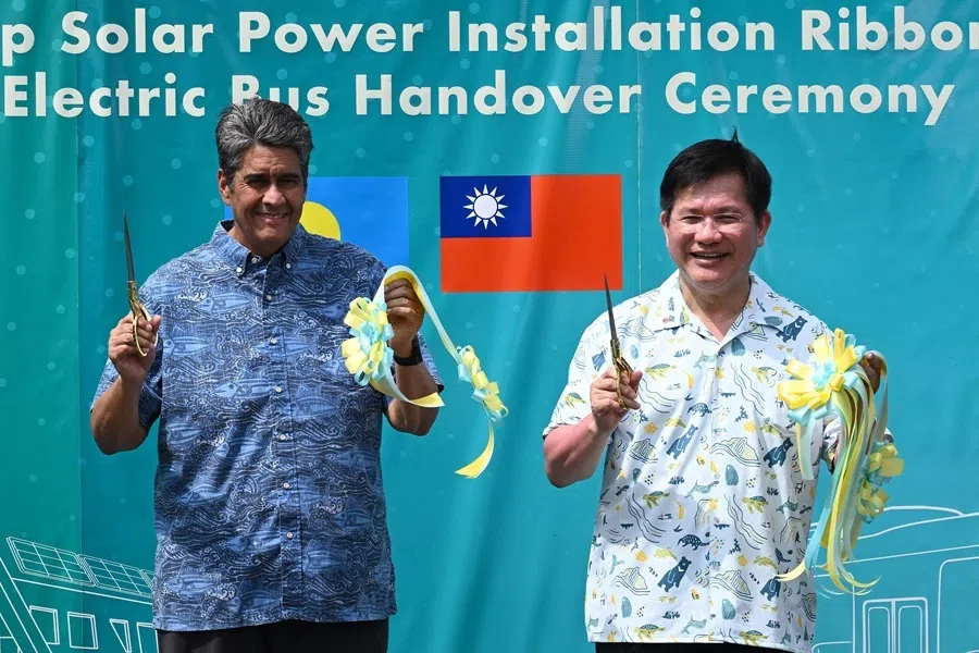 Palau President Surangel S. Whipps Jr. (left) and Taiwan's Foreign Minister Lin Chia-lung gesture after cutting a ribbon during the inauguration ceremony for Taiwan-funded solar energy and electric bus projects in Koror on 30 August 2026, ahead of the 55th Pacific Islands Forum Leaders Meeting.