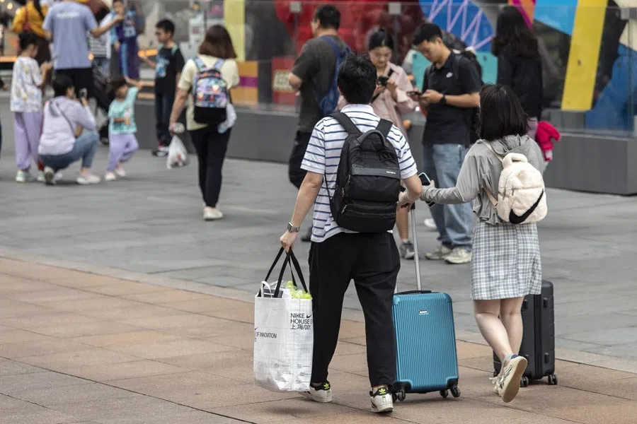 Pedestrians and shoppers on Nanjing Road shopping street in Shanghai, China, on 3 October 2023. (Bloomberg)