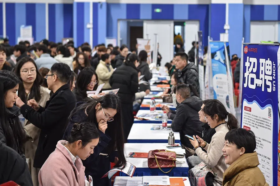 Students attend a job fair at a vocational and technical school in Hefei, in eastern China’s Anhui province on 3 March 2025. (AFP)