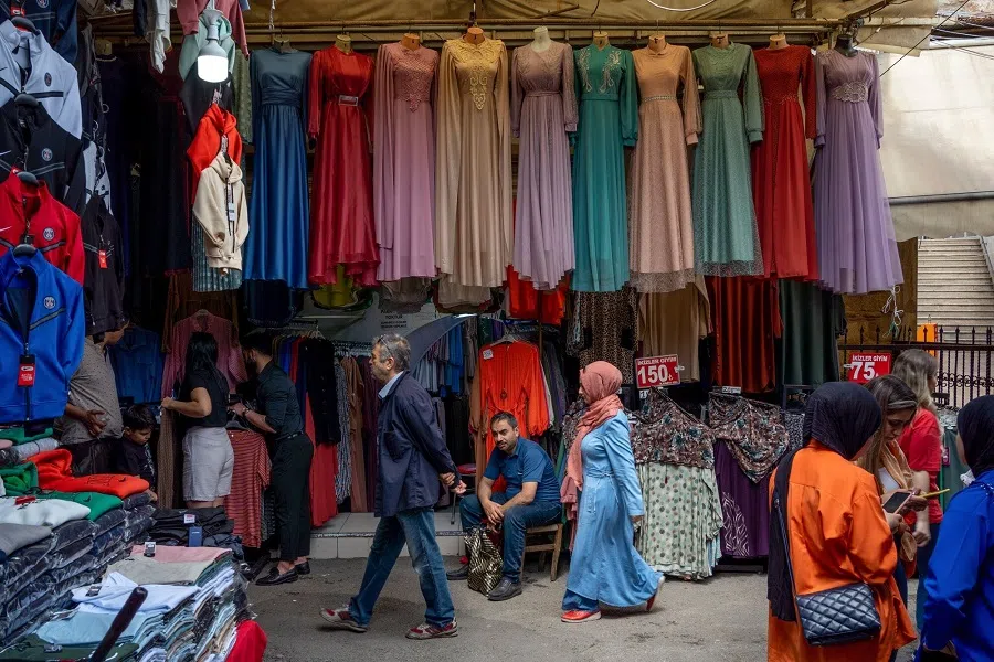 Shoppers at a clothing stall in a local bazaar in Izmir, Turkey, on 19 May 2023. (Moe Zoyari/Bloomberg)