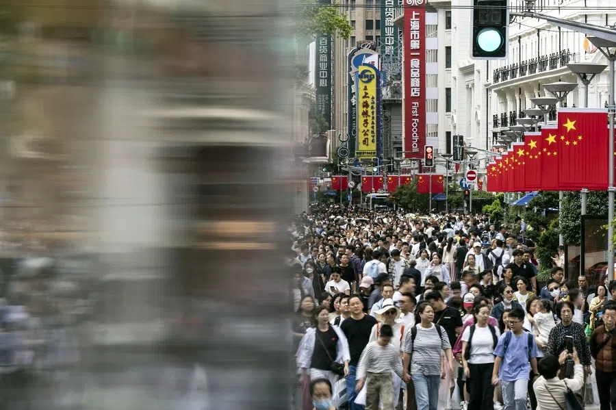 Shoppers on Nanjing East Road in Shanghai, China, 2 October 2024.