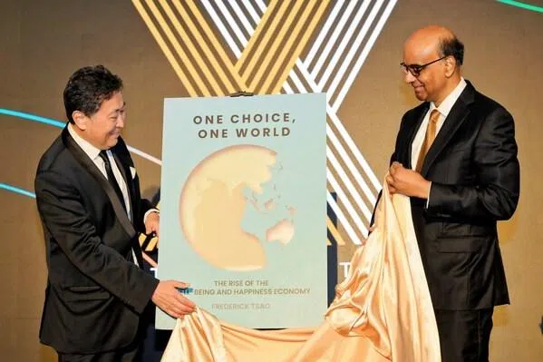 Mr Chavalit Frederick Tsao, Founder of Octave Institute and Chairman of IMC Pan Asia Alliance Group, launched his new book, One Choice, One World: The Rise of the Well-Being and Happiness Economy, with guest-of-honour, Mr Tharman Shanmugaratnam, at The Halogen Ball. (Octave Institute)