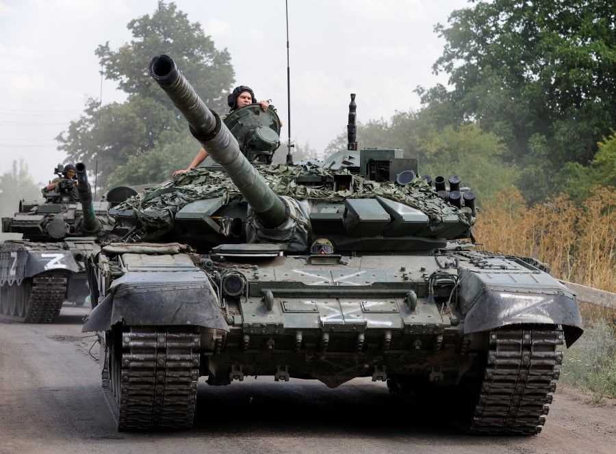 Service members of pro-Russian troops drive tanks in the course of Russia-Ukraine conflict near the settlement of Olenivka in the Donetsk region, Ukraine, 29 July 2022. (Alexander Ermochenko/Reuters)