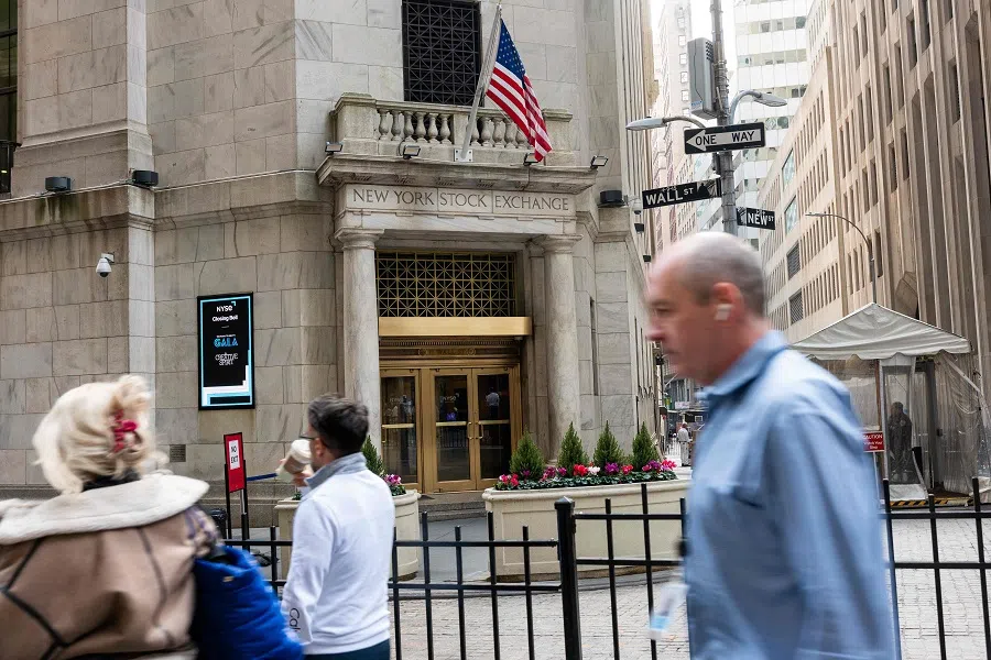 People walk past the New York Stock Exchange (NYSE) on 10 April 2024 in New York City, US. (Spencer Platt/Getty Images/AFP)