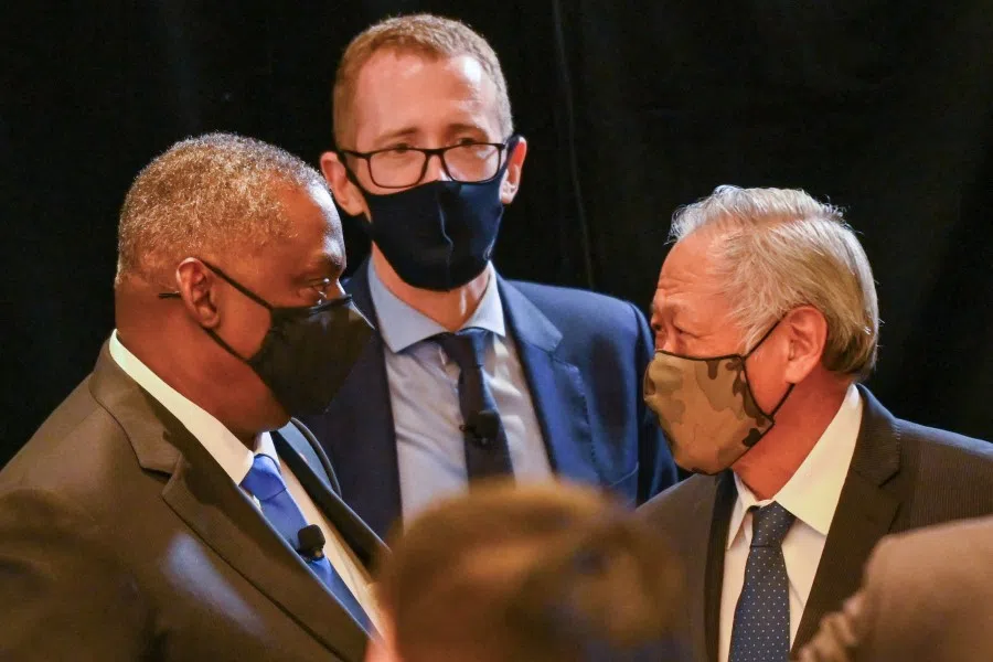 US Secretary of Defence Lloyd Austin speaks (left) speaks with Singapore's Minister of Defence Ng Eng Hen during the 40th International Institute for Strategic Studies (IISS) Fullerton Lecture in Singapore on 27 July 2021. (Roslan Rahman/AFP)