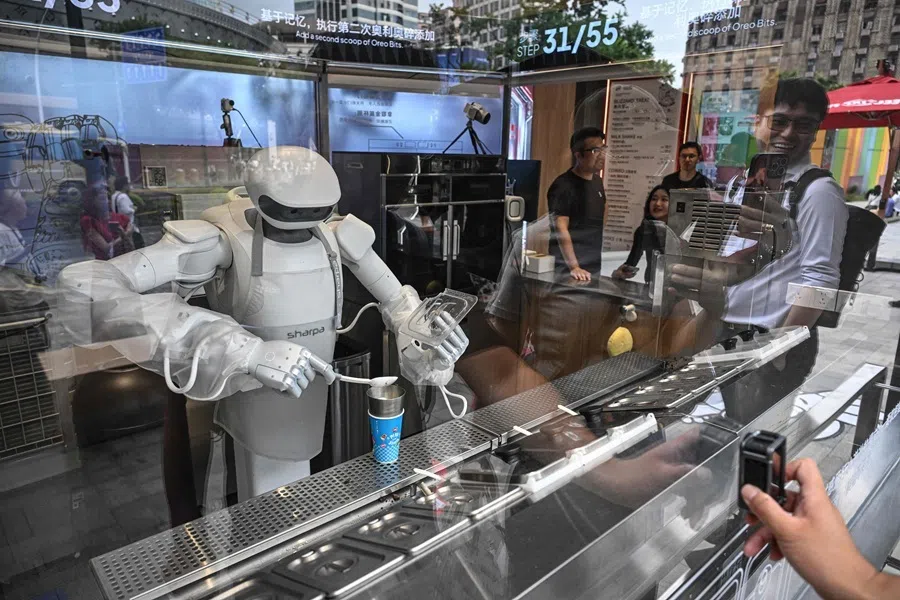 A Sharpa robot makes a Blizzard ice cream for a customer at a Dairy Queen store in Shanghai on 1 September 2026.