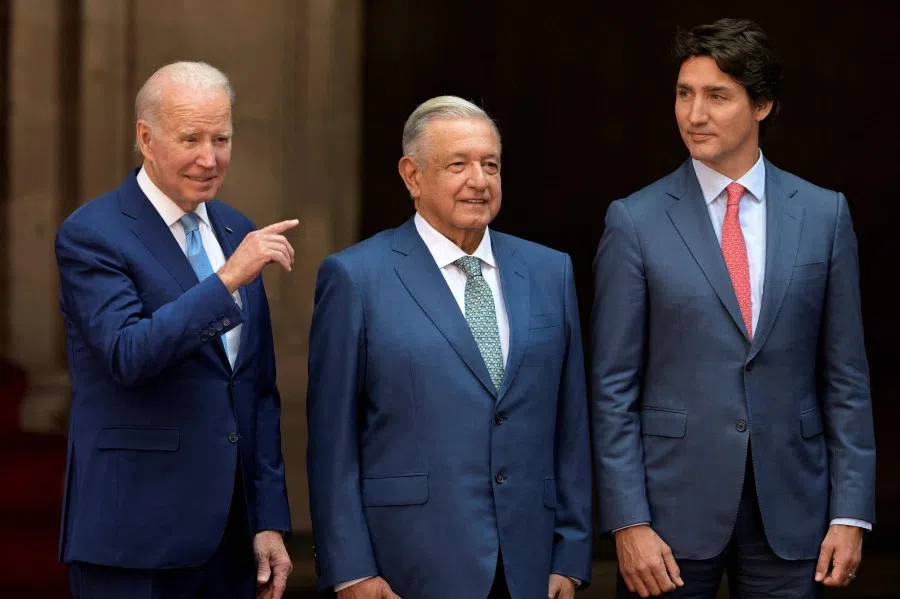 US President Joe Biden (left) gestures next to Mexico's President Andres Manuel Lopez Obrador (centre) and Canada's Prime Minister Justin Trudeau, in Mexico City, on 10 January 2023, during the 10th North American Leaders' Summit. (Nicolas Asfouri/ AFP)
