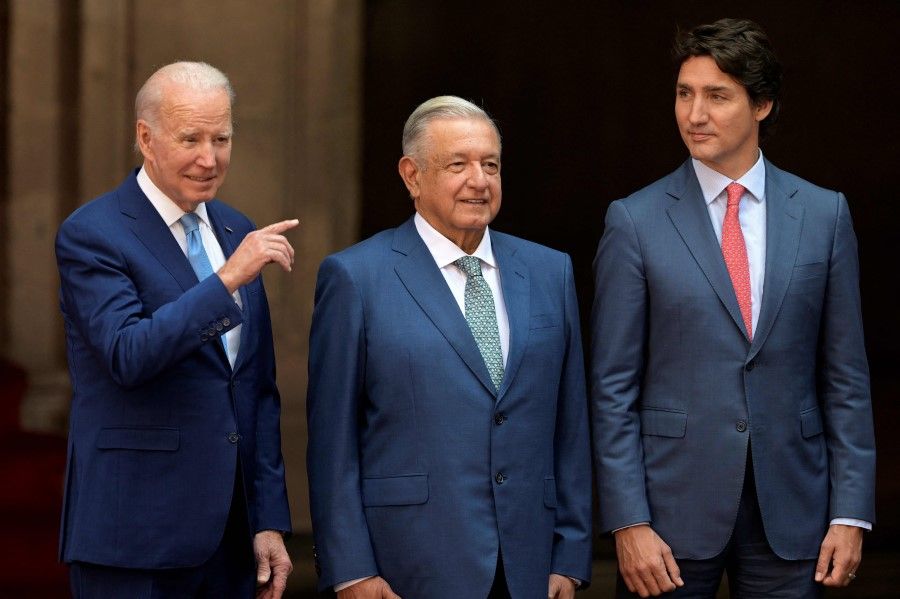 US President Joe Biden (left) gestures next to Mexico's President Andres Manuel Lopez Obrador (centre) and Canada's Prime Minister Justin Trudeau, in Mexico City, on 10 January 2023, during the 10th North American Leaders' Summit. (Nicolas Asfouri/ AFP)