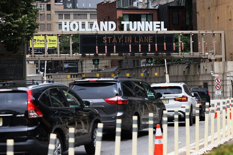Vehicles wait in traffic to enter Holland Tunnel on 2 July 2021 in Lower Manhattan in New York City, US. (Michael M. Santiago/Getty Images/AFP)