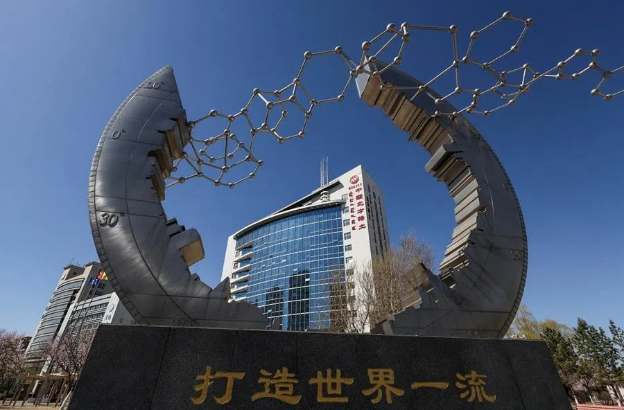 A monument featuring a stylised molecular structure stands outside the office building of China Northern Rare Earth Group in Baotou, China, 6 April 2026.