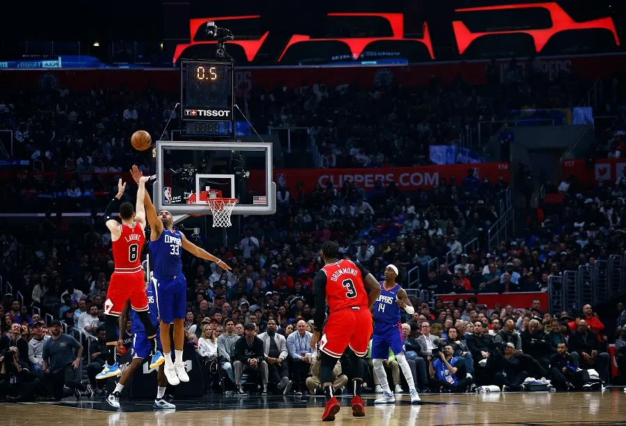 Zach LaVine #8 of the Chicago Bulls makes a shot against Nicolas Batum #33 of the LA Clippers at the end of the first quarter at Crypto.com Arena on 27 March 2023 in Los Angeles, California, US. (Ronald Martinez/Getty Images/AFP)