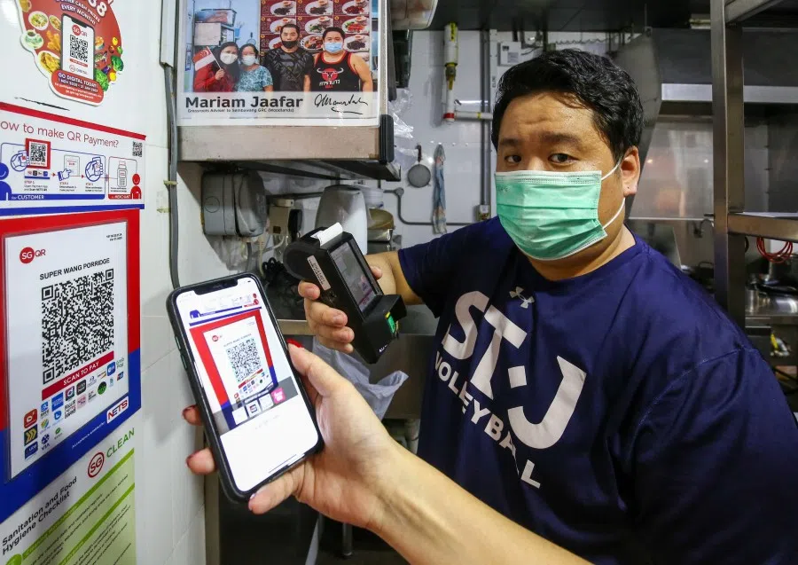 A stall at a hawker centre in Singapore accepting digital payment from a customer, 26 January 2021. (SPH)