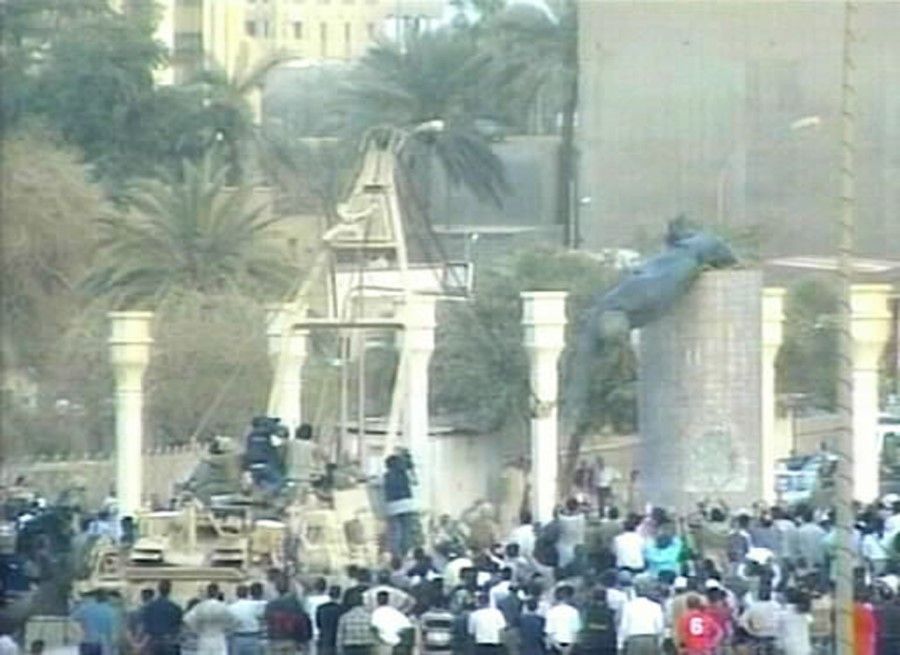 The fall of Baghdad in 2003 was hailed by the White House. It presented a perfect opportunity for its public relations department to pat itself on the back. This is a screen grab from an ABC News feed from central Baghdad showing a US tracked military vehicle pulling down a statue of Iraqi President Saddam Hussein with a rope on 9 April 2003. (Bloomberg)